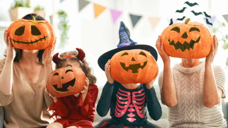 Img-halloween-family-couch shows four people in costumes with will-o'-the-wisps; festive pennants decorate the background.